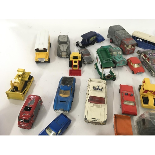 184 - A collection of model diecast vehicles by Dinky. Burago Triang and others. Triang minic clockwork Mo... 