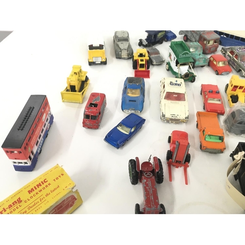 184 - A collection of model diecast vehicles by Dinky. Burago Triang and others. Triang minic clockwork Mo... 