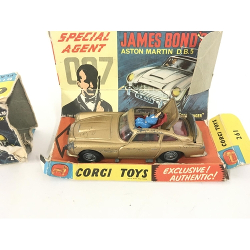 21 - A boxed playworn Corgi 261 Aston Martin James Bond 007 from GOLDFINGER Box in poor condition