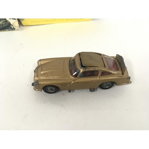 21 - A boxed playworn Corgi 261 Aston Martin James Bond 007 from GOLDFINGER Box in poor condition