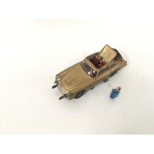 21 - A boxed playworn Corgi 261 Aston Martin James Bond 007 from GOLDFINGER Box in poor condition