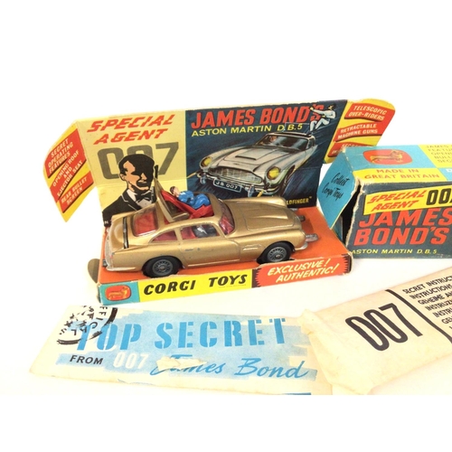 32 - A Boxed Corgi James Bond Aston Martin D.B.5. Box Is Worn. No Sticker or Spare Villain.