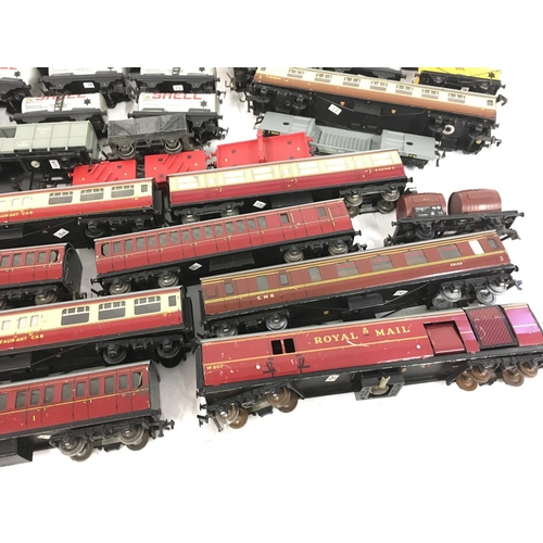 506 - A collection in excess of 50 pieces of model railway carriages and wagons both tinplate and plastic.... 