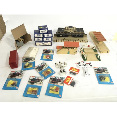 508 - A collection of model railway track and accessories including stations. By a variety of manufacturer... 