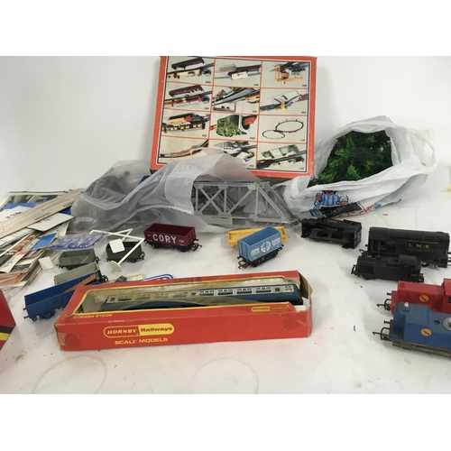 509 - A collection of model railway locomotives and accessories including wagons..buildings ..scenery..cat... 