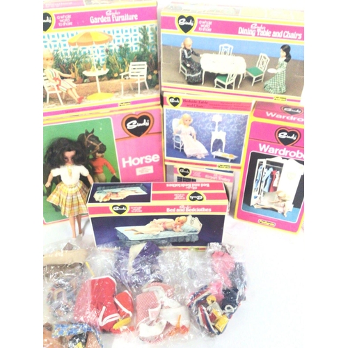 672 - A Collection of Boxed Sindy Furniture. A Doll and accessories. Also a Horse.