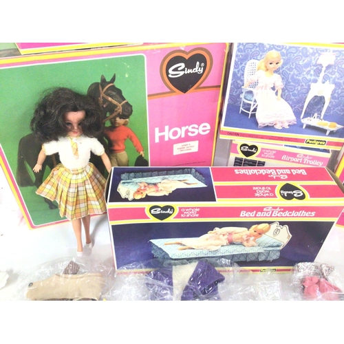 672 - A Collection of Boxed Sindy Furniture. A Doll and accessories. Also a Horse.