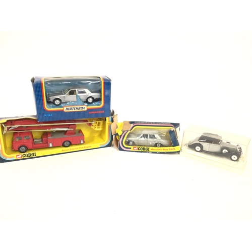 81 - A Boxed Matchbox Rolls Royce #K161. A Corgi Simon Snorkel Fire Engine #1127. A Corgi Mercedes-Benz 2... 