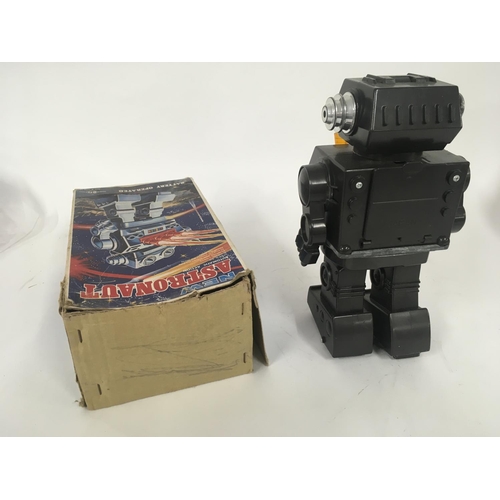 98 - A boxed battery operated robot called ASTRONAUT it has several features. Made in Japan. Box is worn ... 