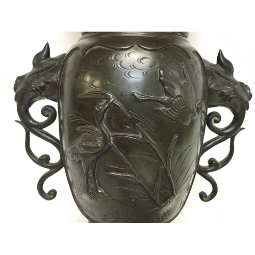 1012 - A large Japanese 19th century bronze vase with raised figures of birds, approximately 40cm tall. Pos... 