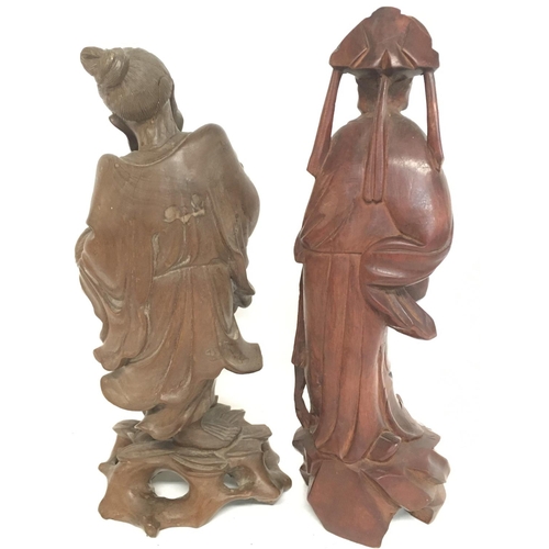 1013 - 19th century wooden carvings of oriental figures. 25cm tall approximately. Postage category C