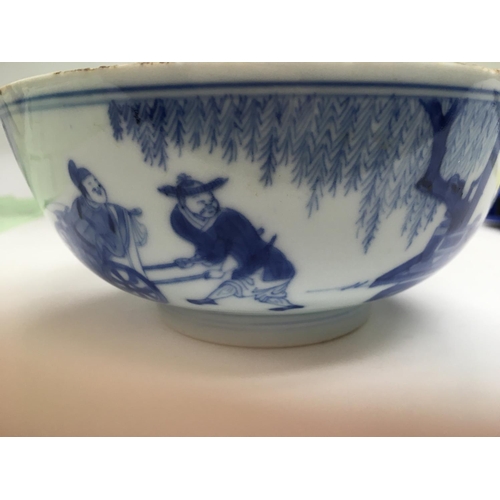 1015 - A Chinese blue and white bowl decorated with figures with garden view .15 cm width height 6.5 cm .