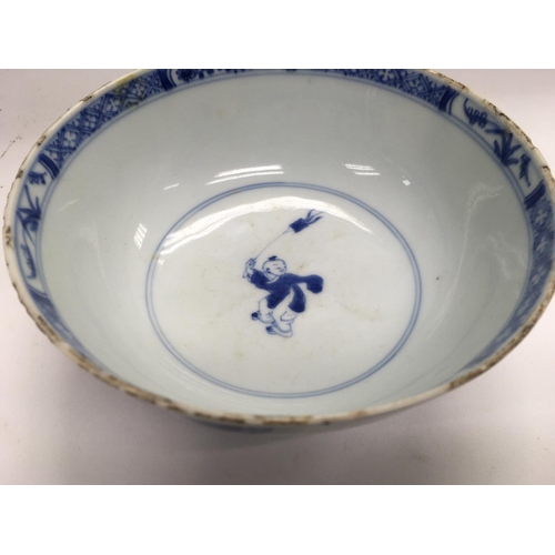 1015 - A Chinese blue and white bowl decorated with figures with garden view .15 cm width height 6.5 cm .