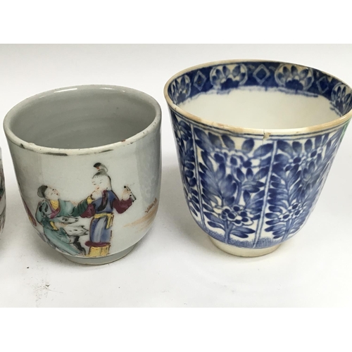 1017 - A collection of Chinese ceramics including a small blue and white vase13 cm four cups and a dish .