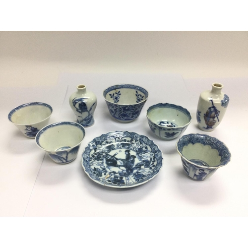 1024 - A small collection of blue and white tea bowls and a pair of bud vases. Shipping category D.