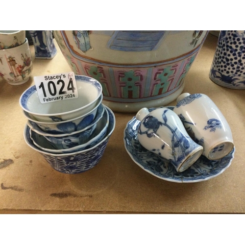 1024 - A small collection of blue and white tea bowls and a pair of bud vases. Shipping category D.