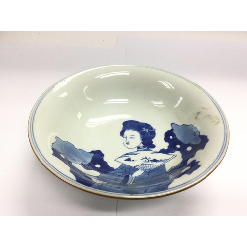 1025 - A blue and white bowl decorated with a geisha to the centre and six character marks to the base, app... 