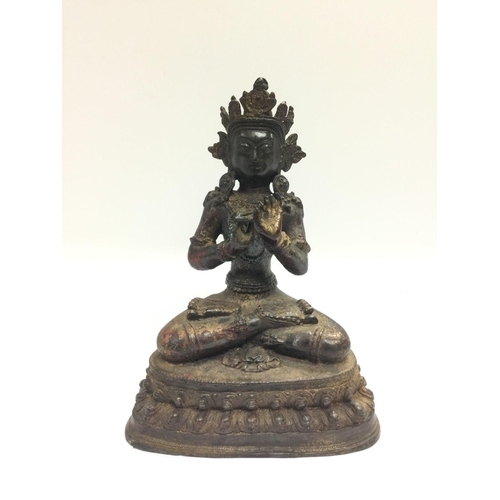 1029 - A bronzed figure if an Eastern deity, approx height 22cm. Shipping category B.