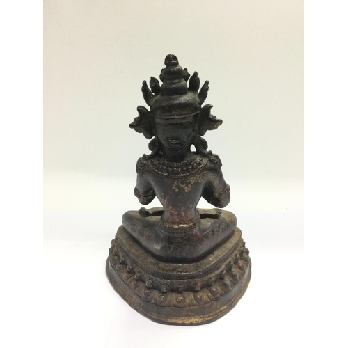 1029 - A bronzed figure if an Eastern deity, approx height 22cm. Shipping category B.