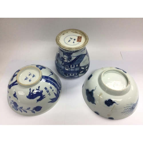 1034 - A blue and white vase decorate with images of pagodas, approx height 16.5cm, plus two blue and white... 