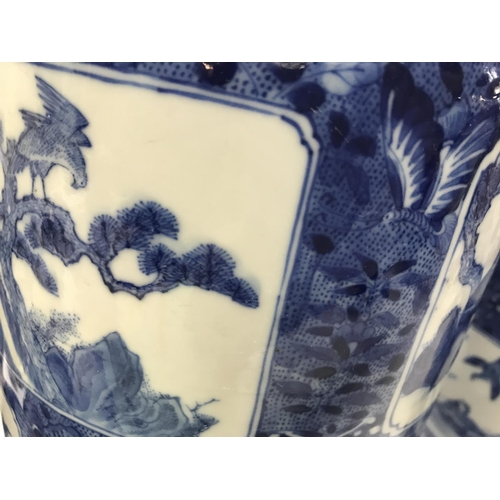 1047 - A pair of Chinese blue and white vases decorated with various panels depicting figures, birds flower... 