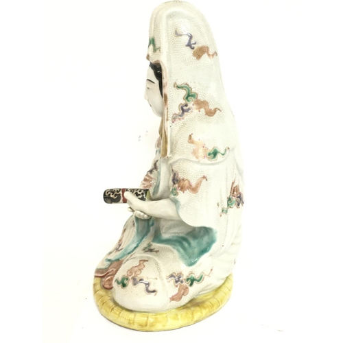 1058 - A late 19th century Japanese Kutani satsuma porcelain figure. 26.5cm tall. Postage category D