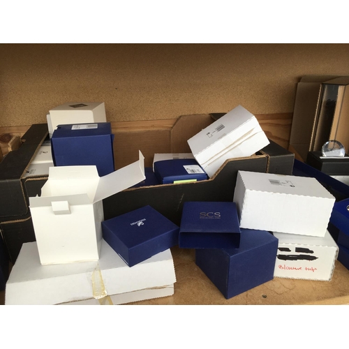 1101 - A box containing a large collection of Swarovski items including magazine holder,Millenium paperweig... 