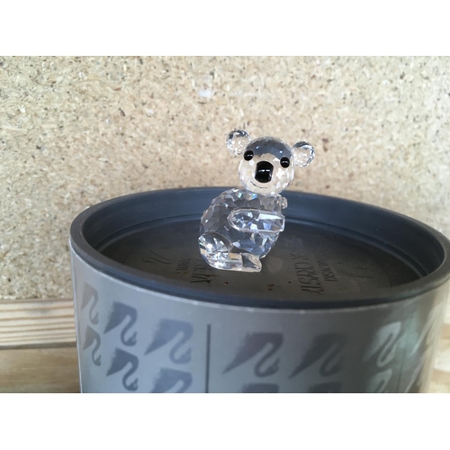 1107 - A large collection of Boxed Swarovski animals from around the world including Large panda holding ba... 