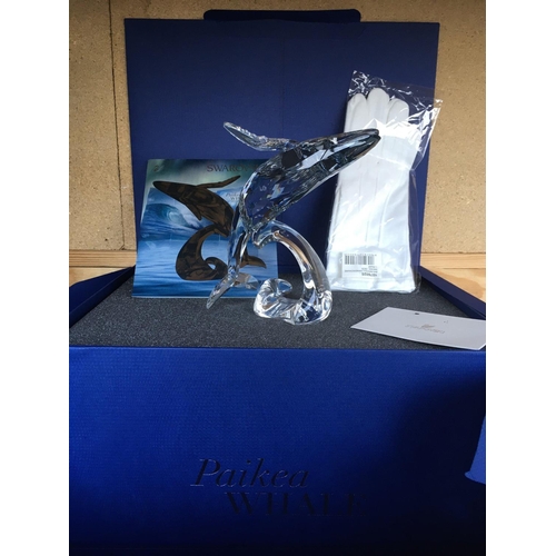 1109 - A large Swarovski Paikea Whale figure breaching against a wave in fitted box with certificate of aut... 