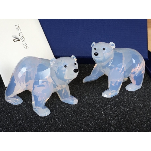 1129 - Swarovski animal figures including a pair of white coloured polar bears, a pair of meerkats, a Hare,... 