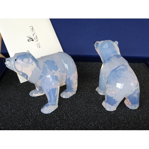 1129 - Swarovski animal figures including a pair of white coloured polar bears, a pair of meerkats, a Hare,... 