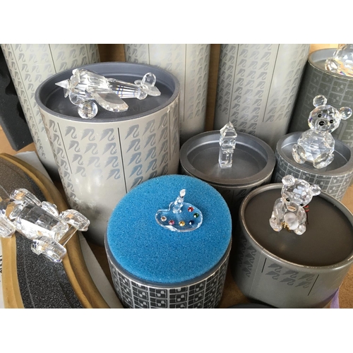 1130 - Swarovski Crystal pieces including Flutes and stands, artist palette, varying sized bears, car and r... 