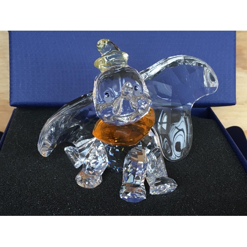 1136 - A boxed Swarovski figure of Disneyâs Dumbo the elephant 2011, with yellow hat and orange necktie. ... 