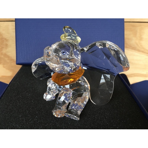 1136 - A boxed Swarovski figure of Disneyâs Dumbo the elephant 2011, with yellow hat and orange necktie. ... 