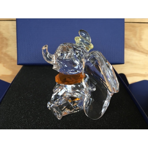 1136 - A boxed Swarovski figure of Disneyâs Dumbo the elephant 2011, with yellow hat and orange necktie. ... 