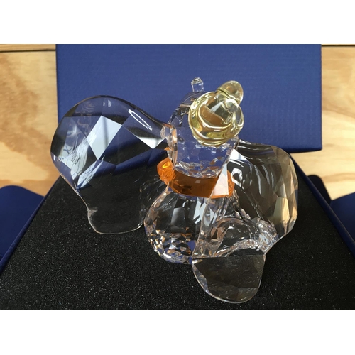 1136 - A boxed Swarovski figure of Disneyâs Dumbo the elephant 2011, with yellow hat and orange necktie. ... 