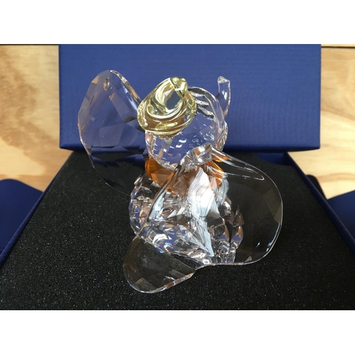 1136 - A boxed Swarovski figure of Disneyâs Dumbo the elephant 2011, with yellow hat and orange necktie. ... 