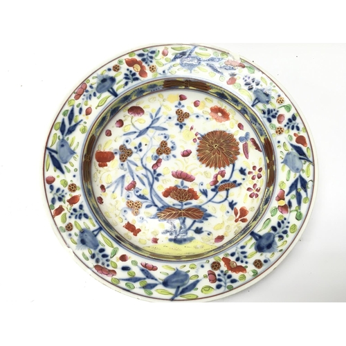 1168 - A 20th century Meissen porcelain charger with floral decoration. Some damage on the base and sides. ... 