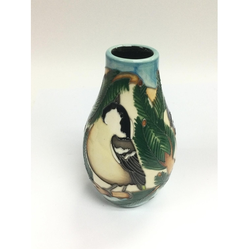 1212 - WITHDRAWN -A small Moorcroft vase depicting coal tits, approx height 13cm. Shipping category D.- NO ... 