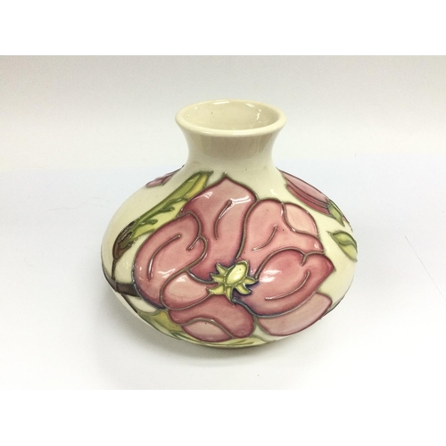 1213 - WITHDRAWN -A Moorcroft onion vase decorated with pink flowers on a cream ground, approx height 10.5c... 