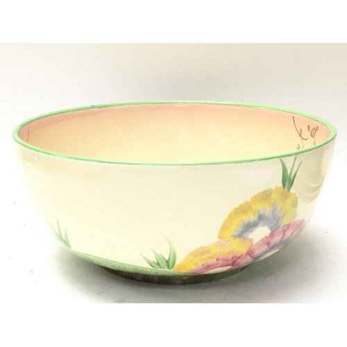 1215 - A Clarice Cliff Honeyglaze bowl, 19.5cm approximately in diameter. postage category D