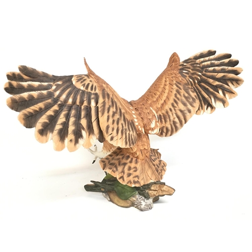 1233 - A Franklin Mint screech owl, approximately 32cm tall. postage category D