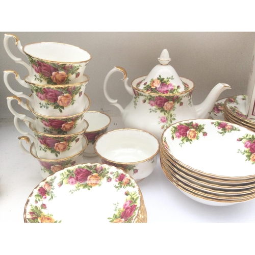 1268 - A Royal Albert Country Rose Tea And Dinner Set.