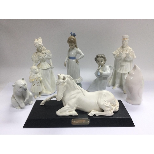 1287 - Seven ceramic figures comprising Lladro, Nao and others. Shipping category D.