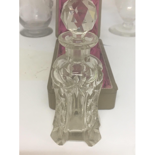 1291 - A cut glass perfume bottle fitted in original box .