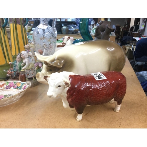 1294 - A Beswick figure of a Herefordshire bull and a ceramic piggy bank (2). Shipping category D.