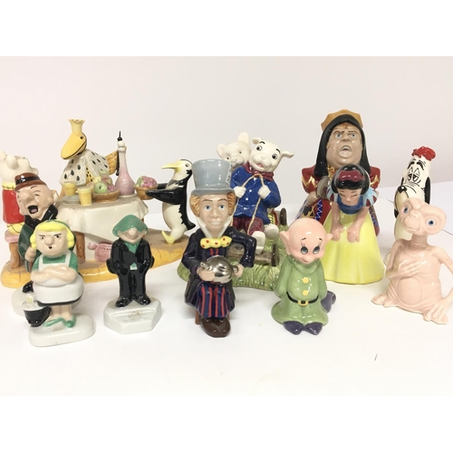 1303 - Two ceramic Royal Doulton figure groups Rupert the bear and other ceramic Disney figures. (a lot)