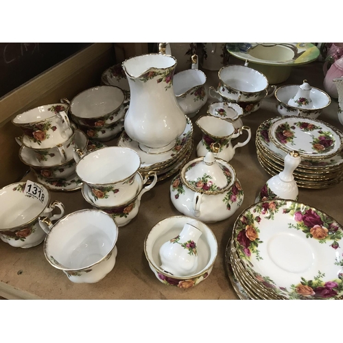 1318 - A Royal Albert country rose Dinner/ tea including coffee pot tea pot serving plates bowls cups and s... 