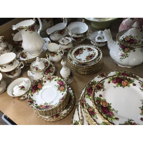 1318 - A Royal Albert country rose Dinner/ tea including coffee pot tea pot serving plates bowls cups and s... 