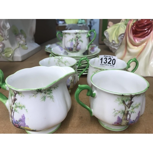 1320 - A Royal Albert greenwood tree tea set comprising cups saucers and side plates sugar bowl . One crack... 